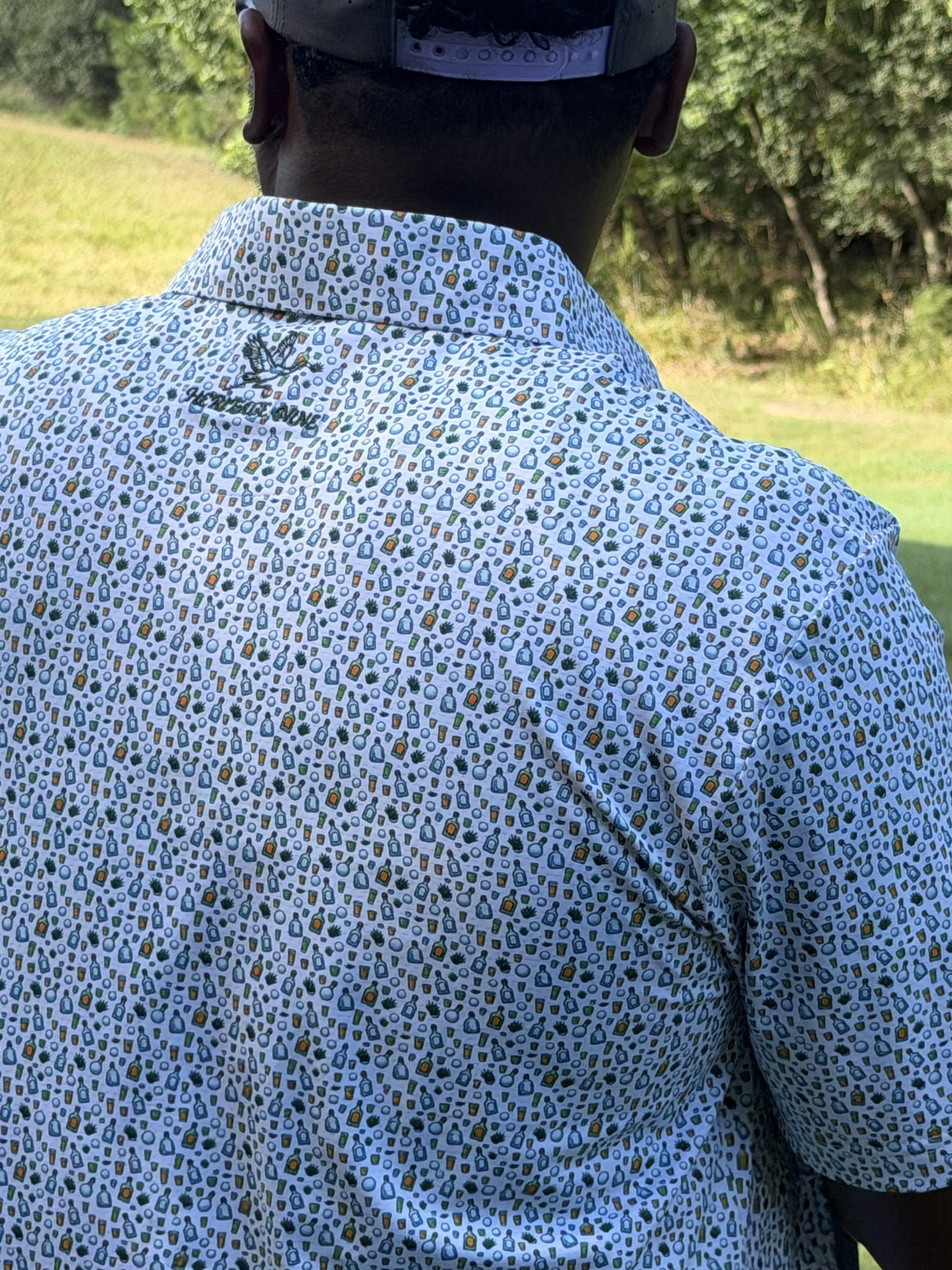Golfer wearing the Heritage Nine Partier polo on the course
